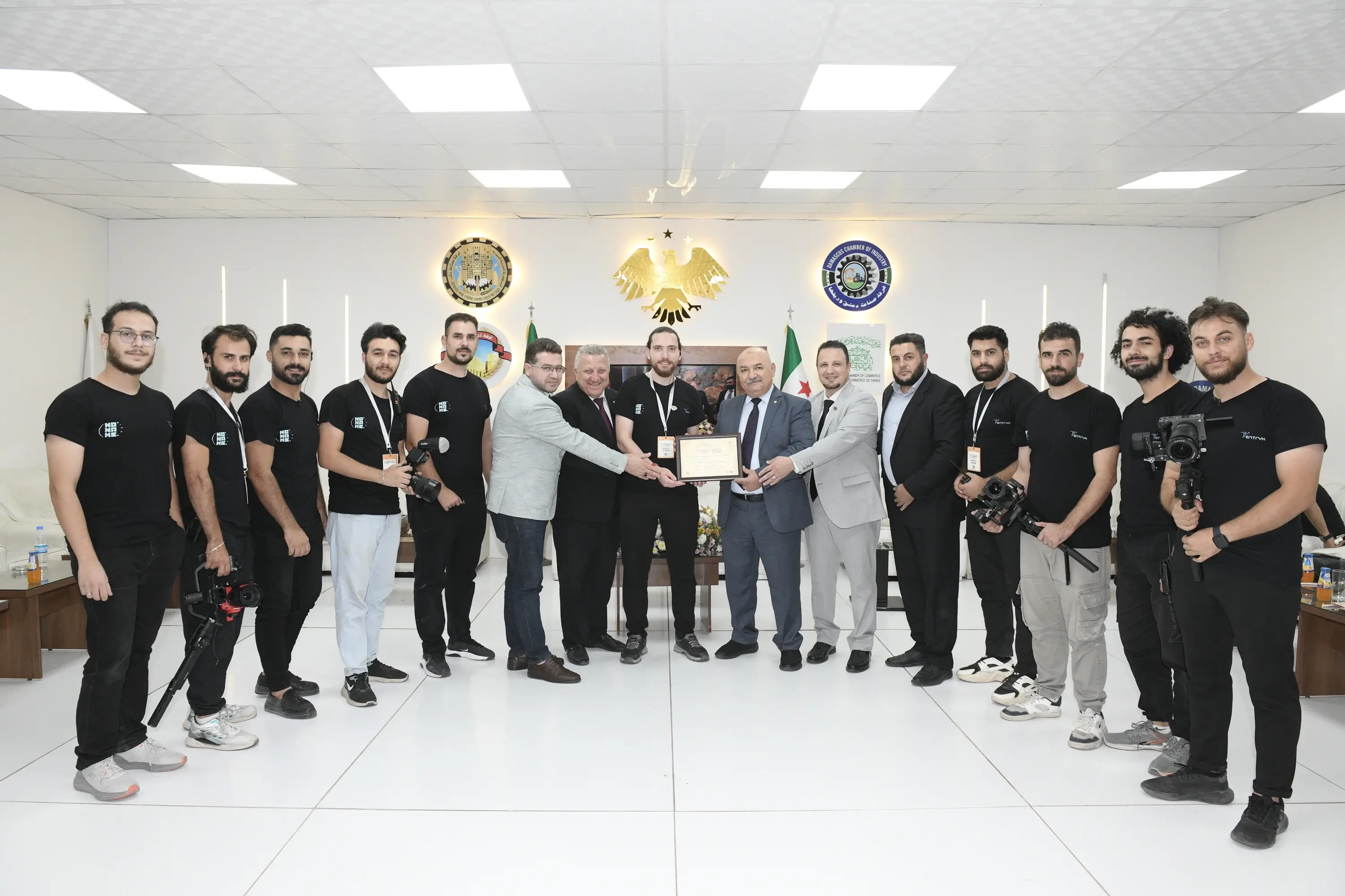 Group of diverse young people collaborating and smiling around a table